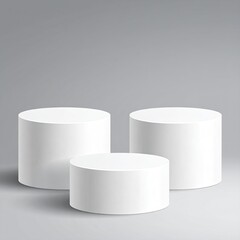 Three white, round, tiered podiums stand on a gray surface
