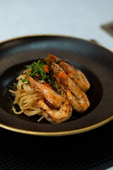 Italian spaghetti pasta with shrimp, Tobiko, spring onion.