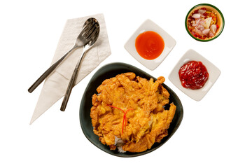 A delicious dish with egg served with sauce and spoon