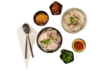 Delicious Vietnamese food on a table, including pho with various toppings