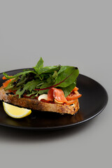 Open Sandwich with Salmon Gravlax, Salad,
Lemon and  Dessing Balsamic.