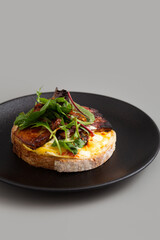 Open Sandwich with Scrambled eggs, Chunk bacon, Salad and Sundry Tomato.