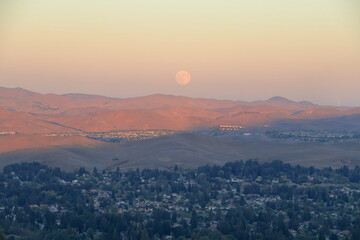 Harvest Supermoon rises in the East Bay hills overlooking San Ramon Valley