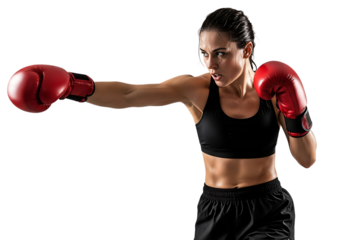 Determined female boxer throwing a punch with red boxing gloves isolated