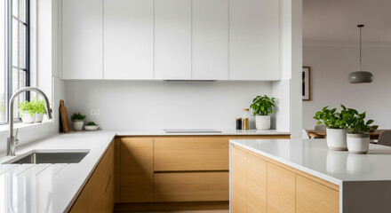 Modern kitchen interior with white and wood cabinets, island, and sink for concept of contemporary home design and real estate