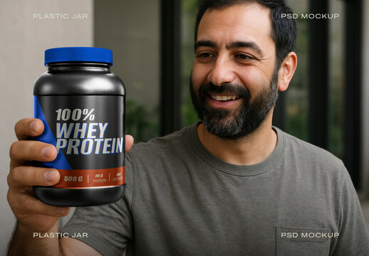 Man Holding Whey Protein Jar Mockup Psd