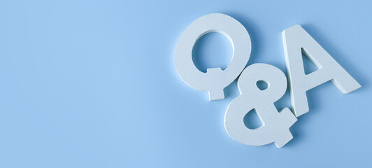 Customer Support and Communication Concept: White Q&A Typography on a Minimal Blue Background