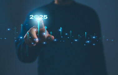 Businessman points to digital goal 2025 with growth arrow graph and business vision, innovation, success, technology and data analytics for strategic planning and goal achievement.