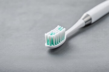 Electric toothbrush head highlighting soft bristles, promoting oral care, health, and daily personal hygiene routine