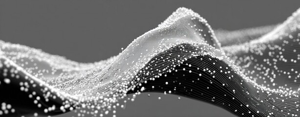 Black and White Close-up of Splashing Water Waves Forming Abstract Mountain Patterns with Glimmering Raindrops in Studio Lighting