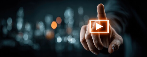Businessman's Finger with Glowing Orange Play Button Icon, Blurred City Lights Background, Symbolizing Video Content and Digital Marketing