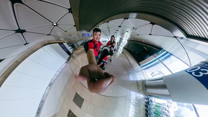 Family taking a selfie with fisheye lens at the airport