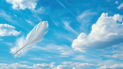 Soft White Feather Gliding Through a Clear Blue Sky with Wispy Cloud Patterns Above