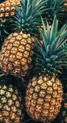 Obraz premium Fresh pineapples stacked together at a local market during sunny daytime