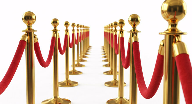 A long perspective of stanchions with red velvet ropes isolated on white background