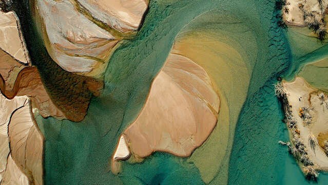 Drone view of river delta with turquoise water and sand textures at Issyk Lake Almaty Kazakhstan
