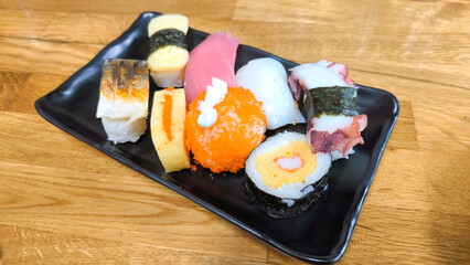 Assorted sushi with sashimi and tamago egg, Japanese traditional sushi platter