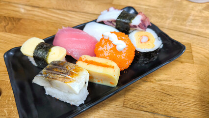 Assorted sushi with sashimi and tamago egg, Japanese traditional sushi platter