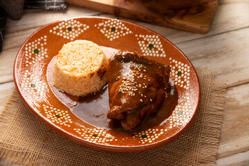 Mole Poblano. Chicken with Mole. Typical dish, emblematic of Mexican food made with a mixture of numerous ingredients. Mole sauce is commonly served with chicken or turkey.
