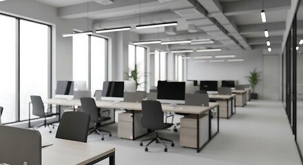 Modern office space with rows of desks and bright natural light