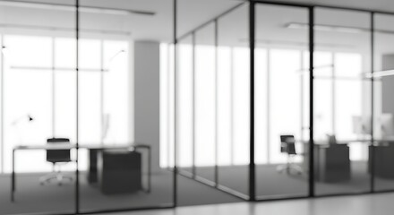 Blurred view of a modern office space with glass partitions