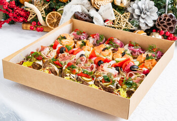 A lovely box of colorful Christmas appetizers, ideal for festive gatherings