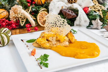 Delicious roasted chicken with a creamy puree, styled elegantly for a festive occasion