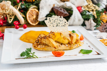 Savory roasted chicken with smooth puree and vibrant garnish, ideal for a feast