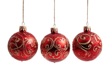 Three shiny red baubles with gold ornate patterns on black