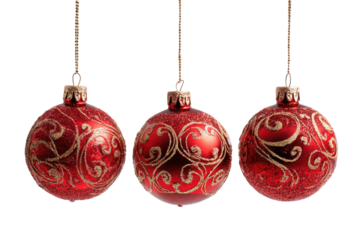 Three shiny red baubles with gold ornate patterns on black