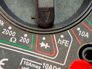 Control dial panel displays varied settings in gray and colorful industrial design aesthetics.