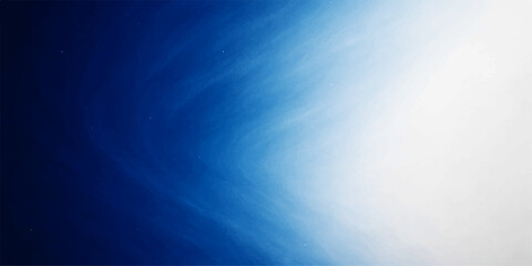 Bright, fluffy white clouds fill the blue sky on a clear summer day, creating a light abstract nature background