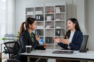 Businesswomen discussing strategy during office collaborative meeting