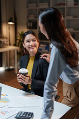 Asian businesswomen discussing work projects, feeling supported