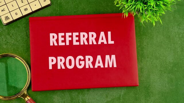 The conceptual text, words, and phrase REFERRAL PROGRAM appear on the cover of the notebook. Business concept. Animated Video