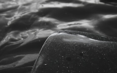Abstract closeup of water surface with light reflections