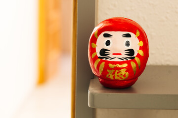 Daruma doll painted in the traditional way