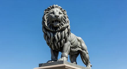 Majestic Lion Statue Against a Clear Blue Sky.