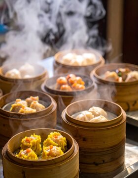 Assortment of various steamed dim sum dishes, in bamboo baskets