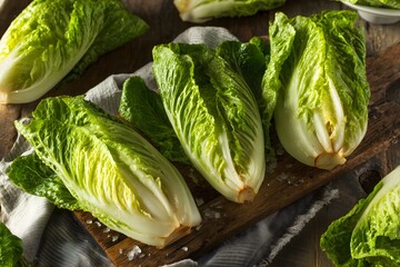 Fresh organic romaine lettuce on wooden board