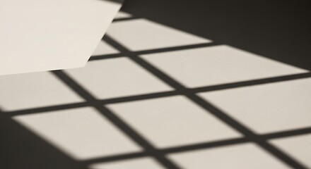 Abstract light and shadow grid pattern on a minimalist surface.