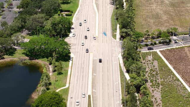 Aerial View of Avenue Traffic in City Suburbs, Florida USA