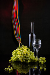 Fototapeta premium Still life with grapes and wine in glasses