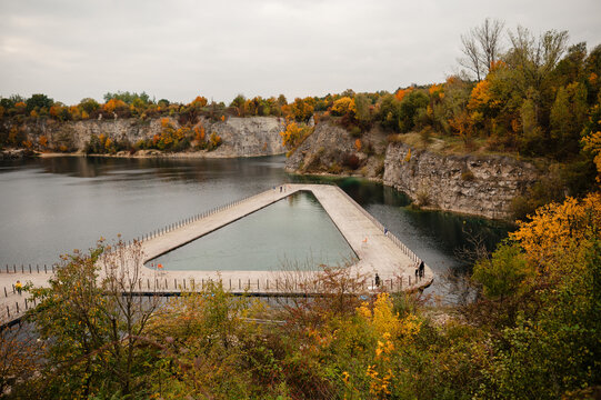 Triangular Pool in Quarry Lake Surrounded by Autumn Foliage