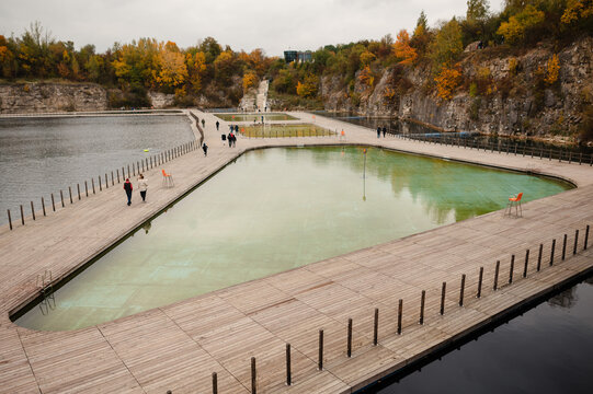 Modern Park with Geometric Water Feature and Autumn Trees