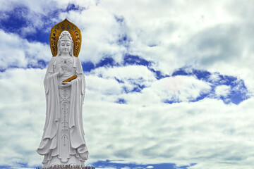 Fototapeta premium The Guanyin statue on Hainan Island, China. A majestic Buddhist monument by the sea