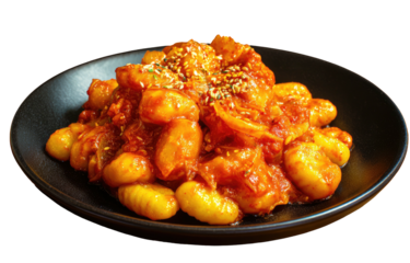 Savory, spicy rice cakes in a rich, red sauce