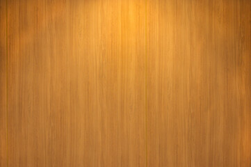 Wooden wall texture with natural grain pattern and soft lighting background