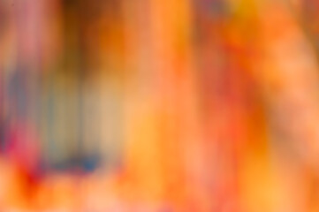 Vibrant warm abstract background with orange and red gradient blurry artistic motion and color harmony