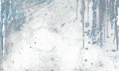 Ethereal ice-blue abstract texture with streaked vertical drips